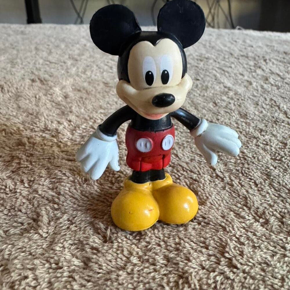 Disney Mickey Mouse figurine that bends at the knees and arms move